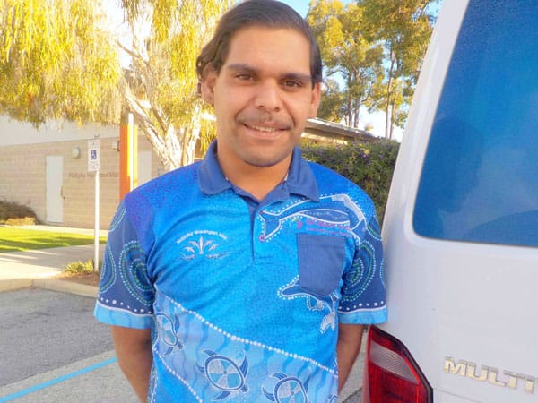 Young Indigenous man in blue shirt